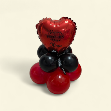 Table top Balloon Arrangement A cluster of red and black balloons topped with a heart-shaped balloon for Valentine's Day.