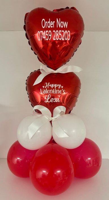 Double Stack Table top Arrangement A cluster of heart-shaped balloons in red and white with a message to order now.
