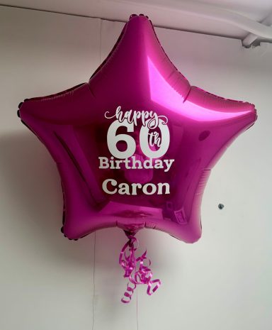 Personalised 18 inch Foil Balloon Purple star-shaped balloon with "Happy 60th Birthday Caron" text.